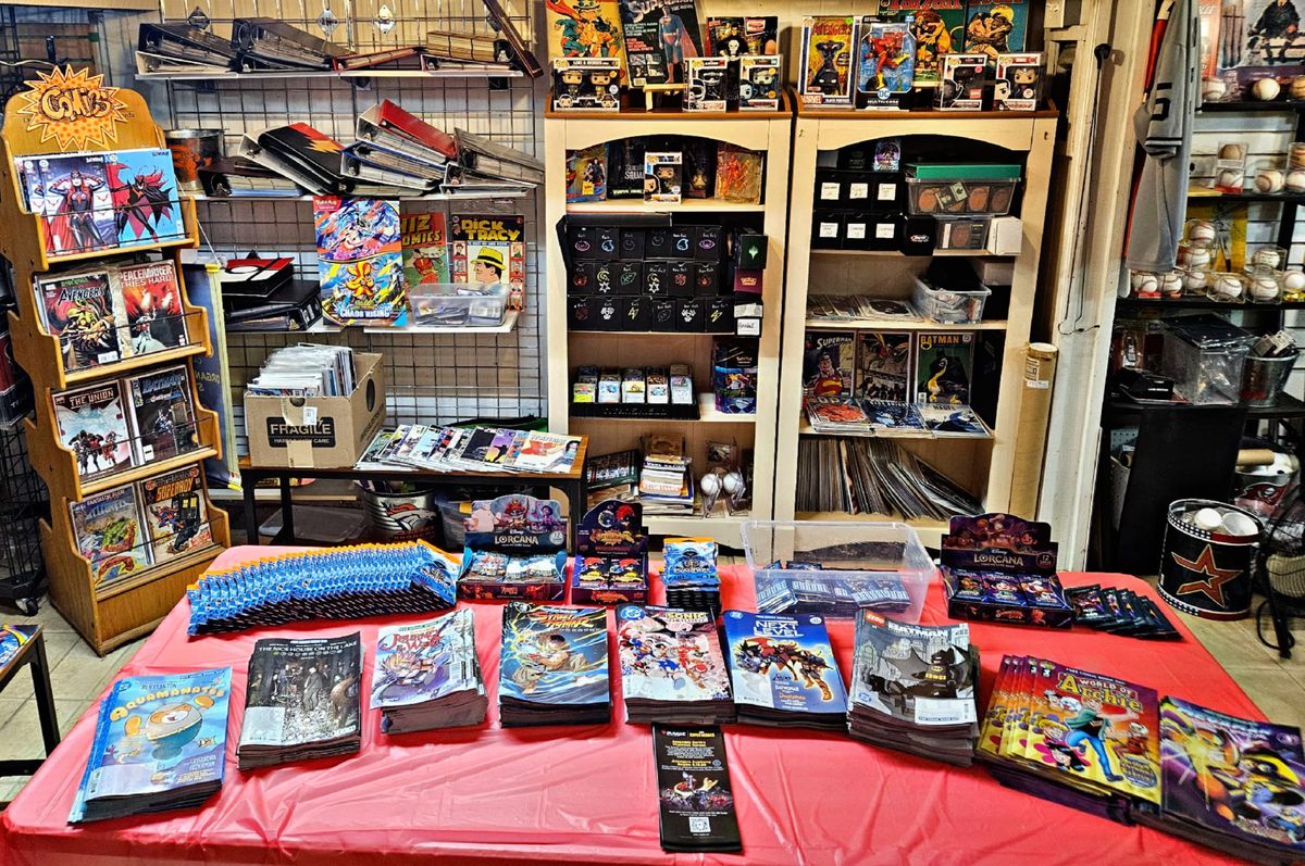 Comics, Lorcana boxes and Funko Pops on display