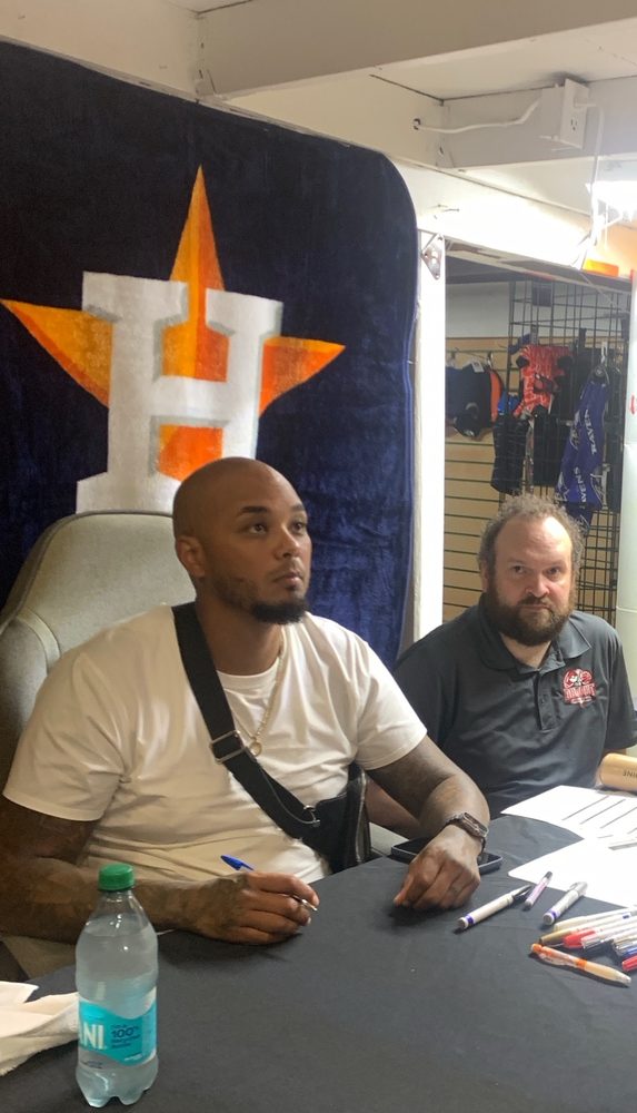 An athlete signing at an in-store signing event at The Dug Out